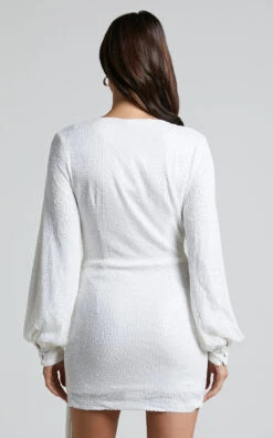 Showpo Claudilyn Mini Dress - Sequin Drape Detail Long Sleeve Faux Wrap Dress In White 16 Showpo Claudilyn Mini Dress - Sequin Drape Detail Long Sleeve Faux Wrap Dress In White -Showpo Women's Clothing Store CLAUDILYN MINI DRESS SEQUIN DRAPE DETAIL LONG SLEEVE FAUX WRAP DRESS IN WHITE 6