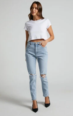 Showpo Izira High Waisted Ripped Mom Jeans In Mid Blue Wash 13 Showpo Izira High Waisted Ripped Mom Jeans In Mid Blue Wash -Showpo Women's Clothing Store Izira Ripped Mom Jeans in Mid Blue Wash 1