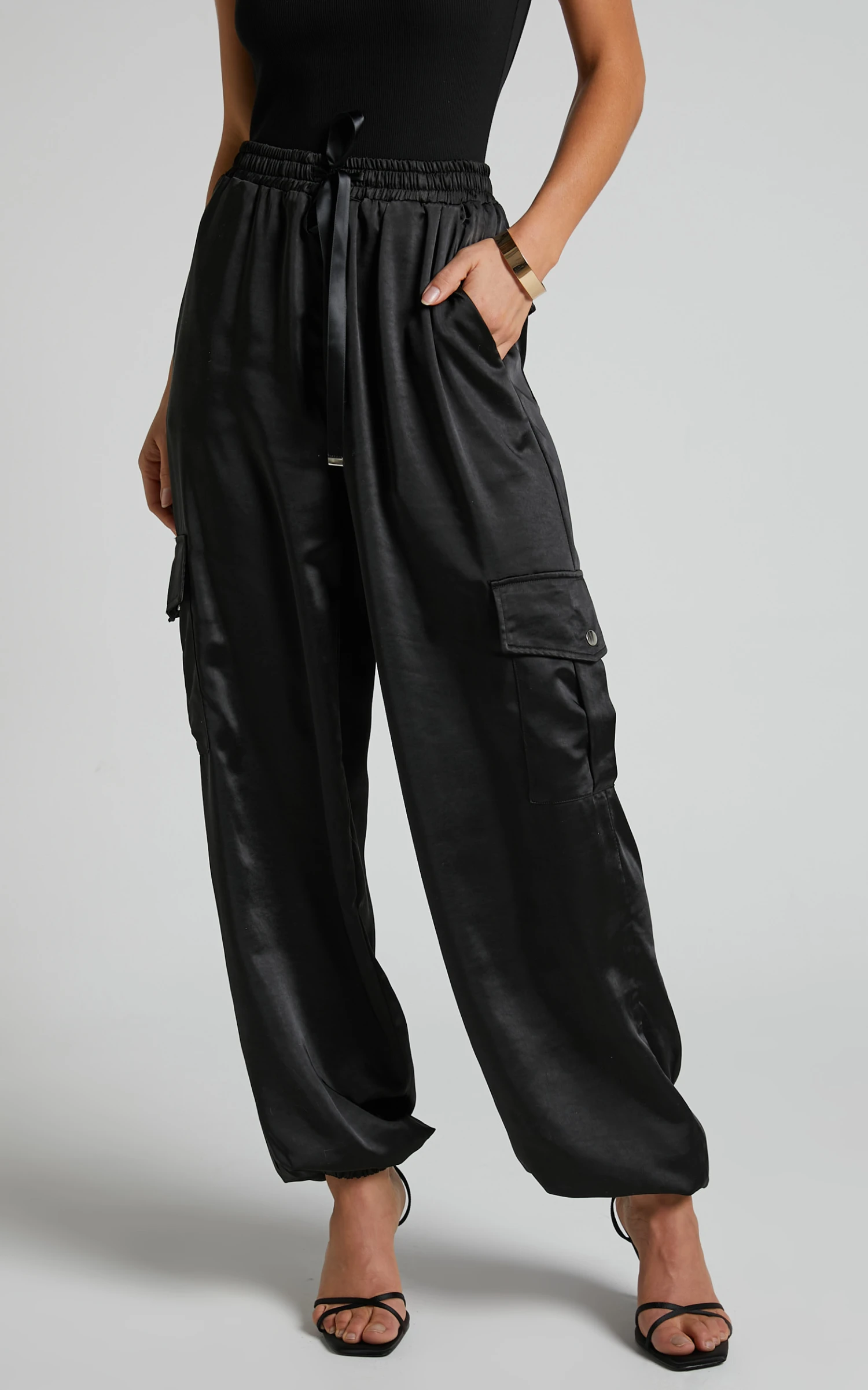 Showpo Jadeiah - Mid Rise Cargo Pocket Satin Jogger Pant In Black 3 Showpo Jadeiah - Mid Rise Cargo Pocket Satin Jogger Pant In Black - Image 3