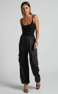 Showpo Jadeiah - Mid Rise Cargo Pocket Satin Jogger Pant In Black 14 Showpo Jadeiah - Mid Rise Cargo Pocket Satin Jogger Pant In Black -Showpo Women's Clothing Store Jadeiah Cargo Pocket Satin Jogger Pant in Black 3