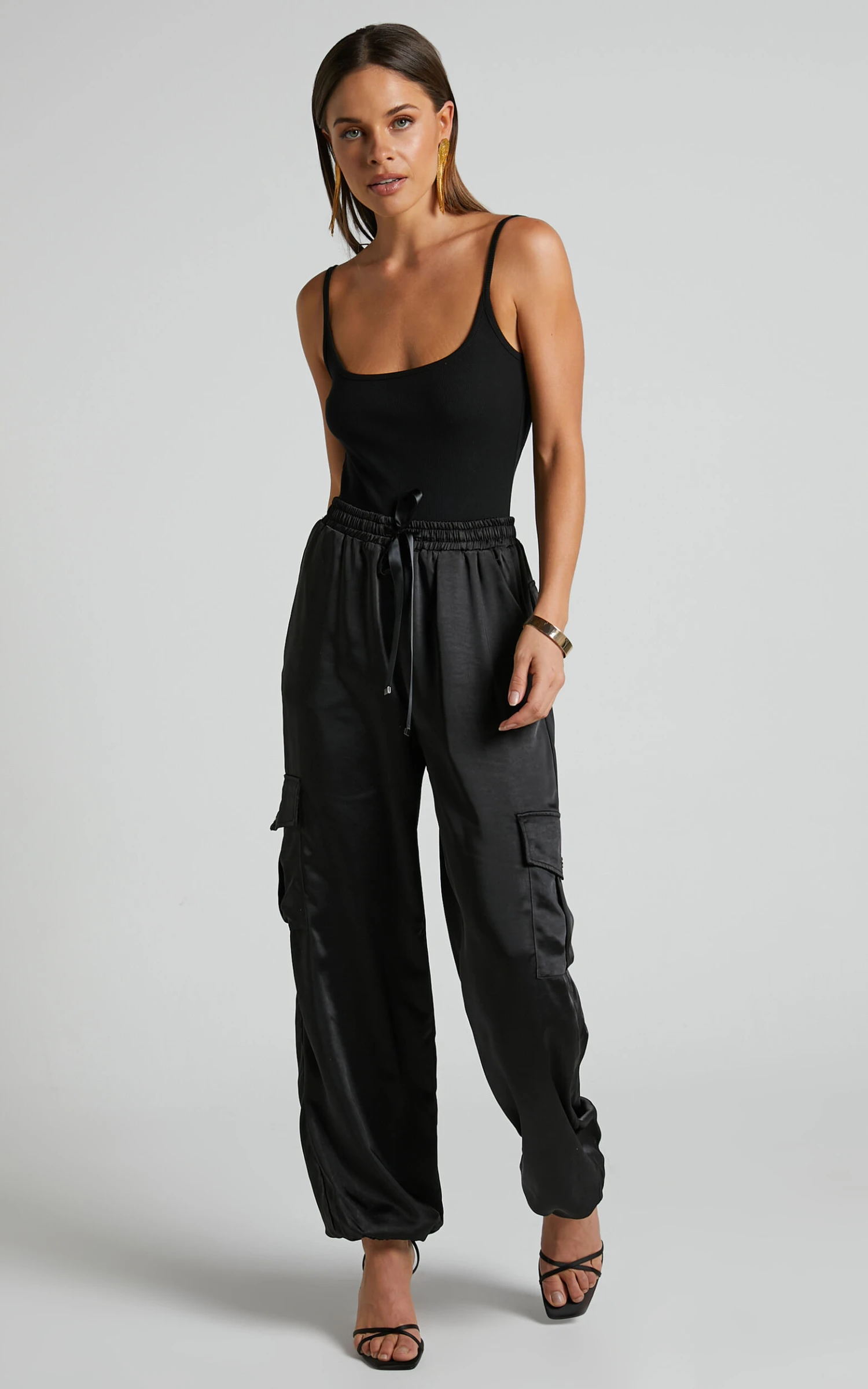 Showpo Jadeiah - Mid Rise Cargo Pocket Satin Jogger Pant In Black 6 Showpo Jadeiah - Mid Rise Cargo Pocket Satin Jogger Pant In Black - Image 6