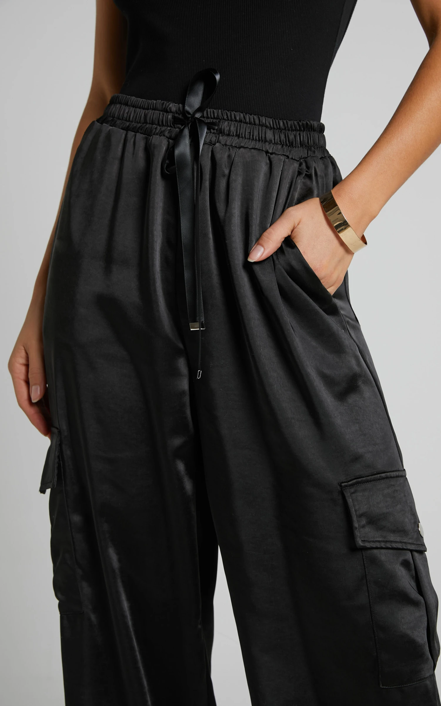 Showpo Jadeiah - Mid Rise Cargo Pocket Satin Jogger Pant In Black 7 Showpo Jadeiah - Mid Rise Cargo Pocket Satin Jogger Pant In Black - Image 7