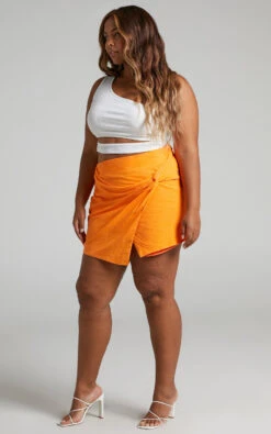 Showpo Kiandra Knot Detail Mini Skirt In Orange 13 Showpo Kiandra Knot Detail Mini Skirt In Orange -Showpo Women's Clothing Store Kiandra Knot Detail Mini Skirt in Orange 2528SB21070036042529 1