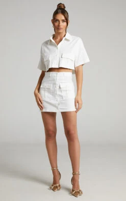 Showpo Navine Button Front Crop Top And Cargo Pocket Mini Skirt Two Piece Set In White 15 Showpo Navine Button Front Crop Top And Cargo Pocket Mini Skirt Two Piece Set In White -Showpo Women's Clothing Store Navine Two Piece Skirt Set with Pockets in White 2528SC22030024012529