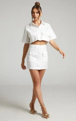 Showpo Navine Button Front Crop Top And Cargo Pocket Mini Skirt Two Piece Set In White 13 Showpo Navine Button Front Crop Top And Cargo Pocket Mini Skirt Two Piece Set In White -Showpo Women's Clothing Store Navine Two Piece Skirt Set with Pockets in White 2528SC22030024012529 2