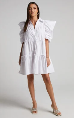 Showpo Sula Mini Dress - Tiered Voluminous Puff Sleeve Dress In White 12 Showpo Sula Mini Dress - Tiered Voluminous Puff Sleeve Dress In White -Showpo Women's Clothing Store Sula Voluminous Puff Sleeve Mini Dress in White 2528SD22090033022529 1