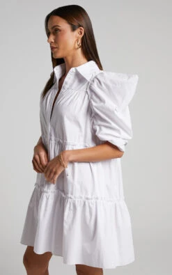 Showpo Sula Mini Dress - Tiered Voluminous Puff Sleeve Dress In White 11 Showpo Sula Mini Dress - Tiered Voluminous Puff Sleeve Dress In White -Showpo Women's Clothing Store Sula Voluminous Puff Sleeve Mini Dress in White 2528SD22090033022529 3