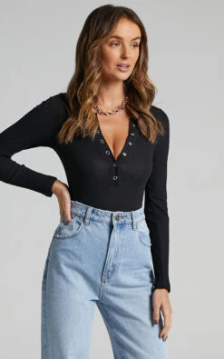 Showpo Tatem Longsleeve Button Front Bodysuit In Black 17 Showpo Tatem Longsleeve Button Front Bodysuit In Black -Showpo Women's Clothing Store Tatem Longsleeve Button Front Bodysuit in Black ST2106004601 2